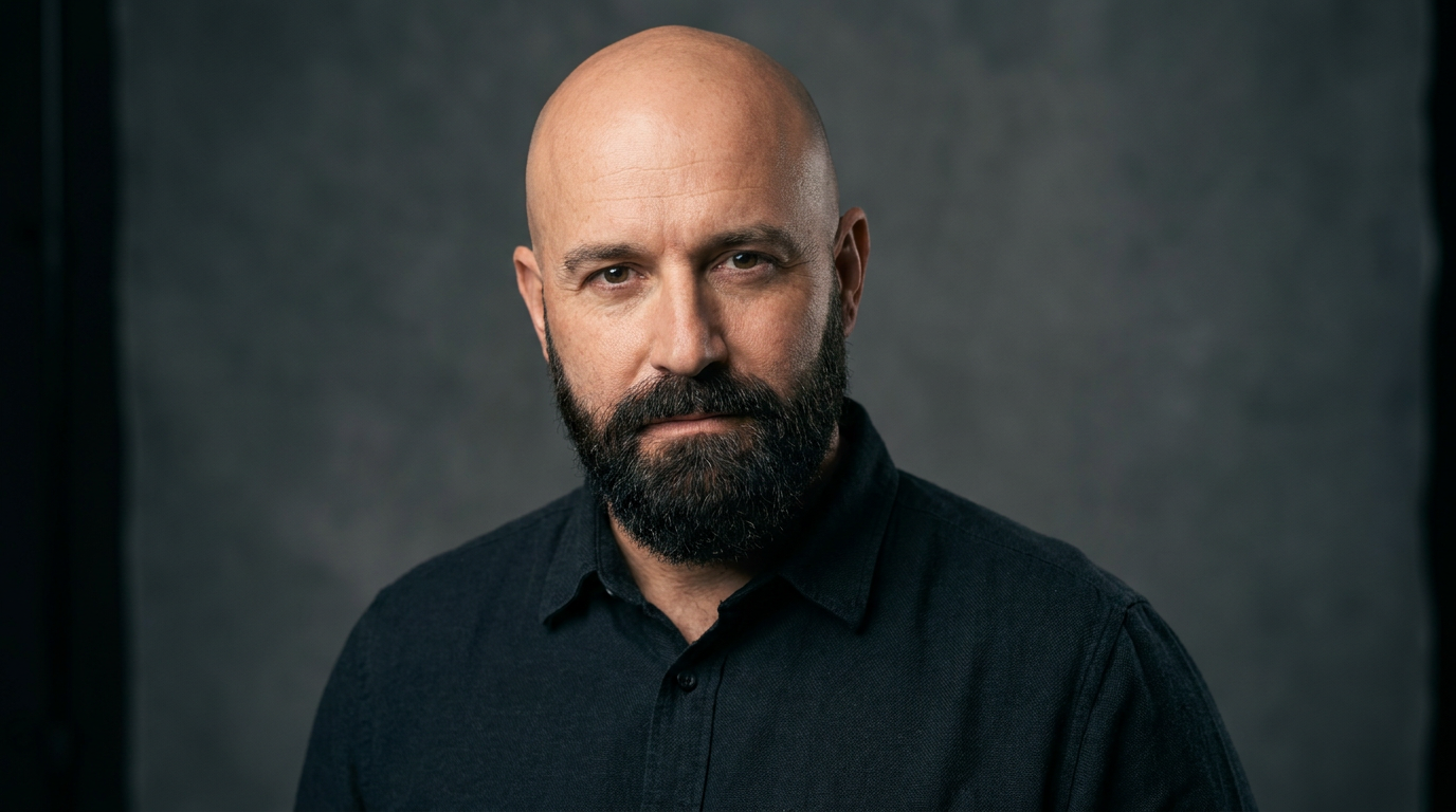 Bald head paired with a full dark beard generated on a portrait with the AI bald generator