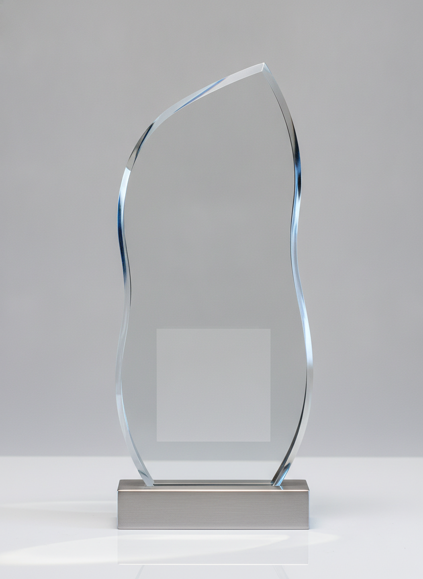 A modern award cut from a single thick slab of clear acrylic in a soft asymmetric wave, standing in a slim brushed aluminium foot, with a blank frosted panel low on the face and a pale caustic reflection thrown onto the white surface beneath it