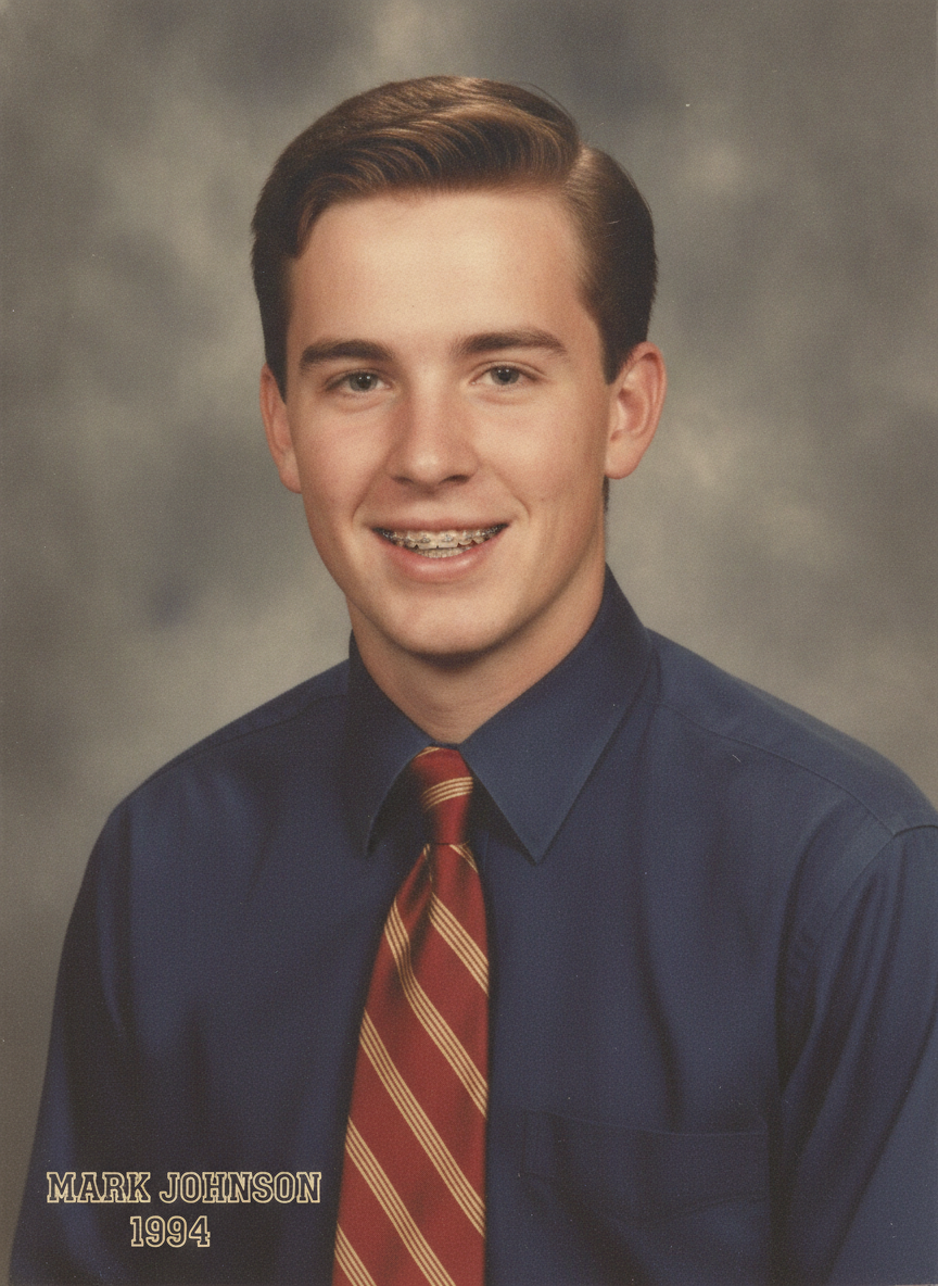 Classic 90s yearbook senior portrait of a young man in a collared shirt and tie created with the AI yearbook photo generator
